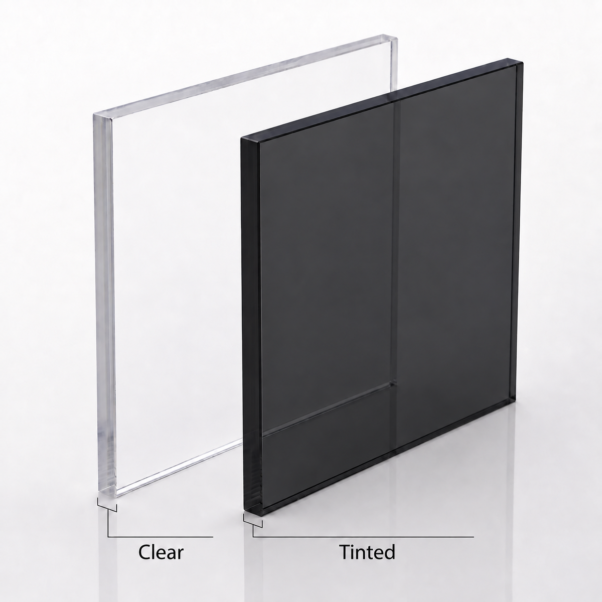Two rectangular acrylic sheets, one clear and one tinted grey, standing upright for a Window Cat Door Insert.